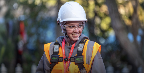 Young woman wearing high vis and hard hat