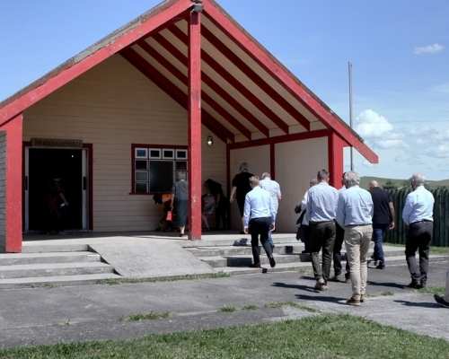 Group walking into a marae