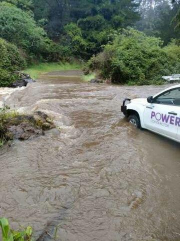 Powerco contractor vehicle stopped by flood waters  on Coromandel Peninsuala