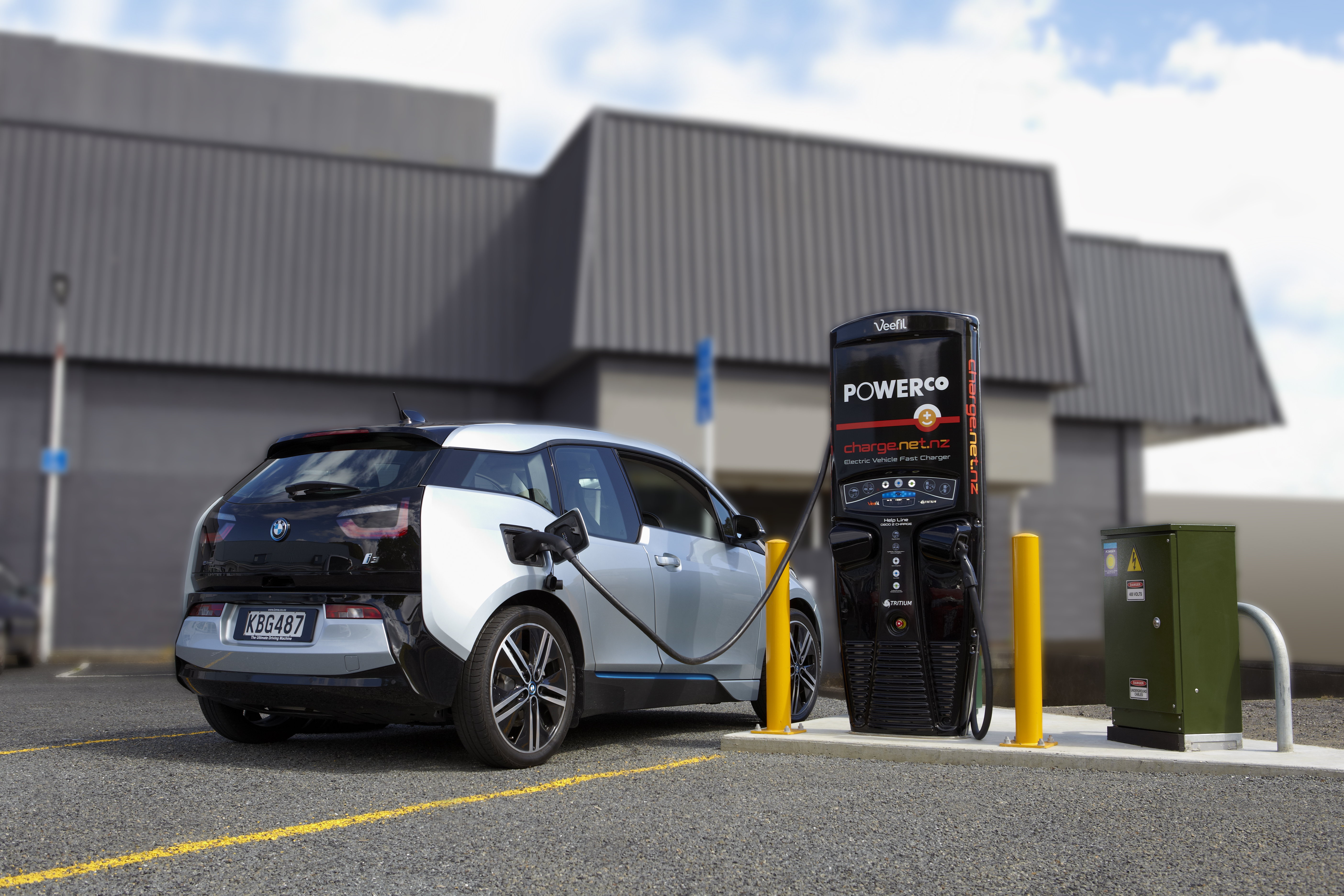 Electric vehicle plugged in for charging.